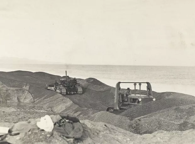 Bulldozer working on seaward end of cut
